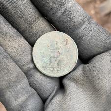 A 1799 George III halfpenny showing Britannia on the coin's reverse side. This may have been dropped by someone in the graveyard but we have also found coins in a couple of graves, either lost by gravediggers or deliberately placed with the burial.