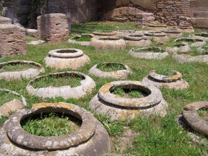 Image 5. Rows of dolia/seria for storing wine or olive-oil at Caseggiato dei Doli (House of the Dolia) at Ostia Antica in Italy. Image: Mathew Morris